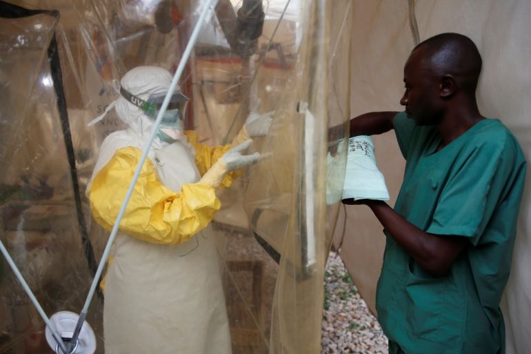 A health worker wearing Ebola protection gear enters the Biosecure Emergency Care Unit (CUBE) at the ALIMA (The Alliance for International Medical Action) Ebola treatment centre in Beni, in the Democratic Republic of Congo, March 30, 2019. Picture taken March 30, 2019. REUTERS/Baz Ratner