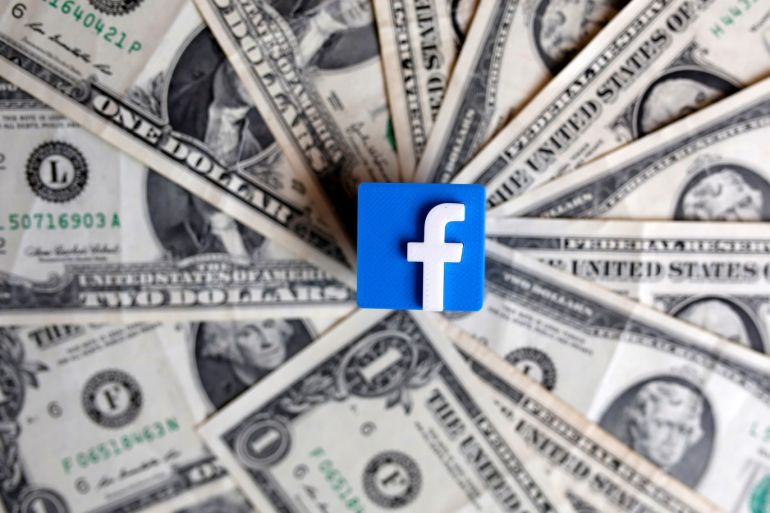 A 3-D printed Facebook logo is seen on U.S. dollar banknotes in this illustration picture, June 18, 2019. REUTERS/Dado Ruvic/Illustration