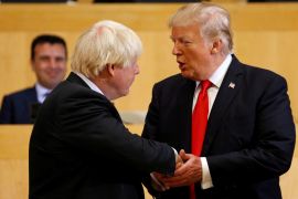 U.S. President Donald Trump shakes hands with British Foreign Secretary Boris Johnson (L) as they take part in a session on reforming the United Nations at U.N. Headquarters in New York, U.S., September 18, 2017. REUTERS/Kevin Lamarque