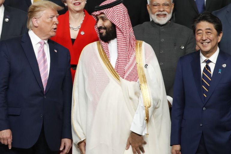 OSAKA, JAPAN - JUNE 28: U.S. President Donald Trump speaks with Saudi Arabia's Crown Prince Mohammed bin Salman during a family photo session at G20 summit on June 28, 2019 in Osaka, Japan. U.S. President Donald Trump arrived in Osaka on Thursday for the annual Group of 20 gathering together with other world leaders who will use the two-day summit to discuss pressing economic, climate change, as well as geopolitical issues. The US-China trade war is expected to dominate the meetings in Osaka as President Trump and China's President Xi Jinping are scheduled to meet on Saturday in an attempt to resolve the ongoing the trade clashes between the world's two largest economies. (Photo by Kim Kyung-Hoon - Pool/Getty Images)