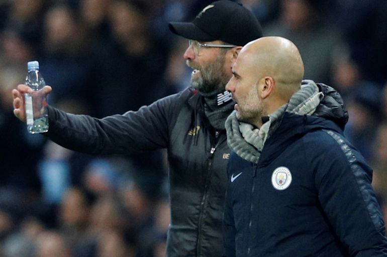 Soccer Football - Premier League - Manchester City v Liverpool - Etihad Stadium, Manchester, Britain - January 3, 2019 Manchester City manager Pep Guardiola and Liverpool manager Juergen Klopp talk to each other during the match REUTERS/Phil Noble EDITORIAL USE ONLY. No use with unauthorized audio, video, data, fixture lists, club/league logos or