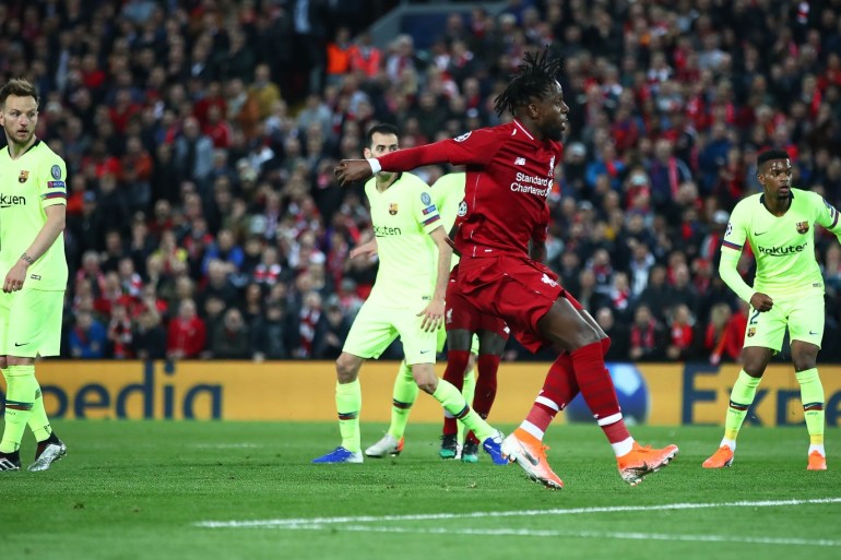 LIVERPOOL, ENGLAND - MAY 07: Divock Origi of Liverpool scores his team's fourth goal during the UEFA Champions League Semi Final second leg match between Liverpool and Barcelona at Anfield on May 07, 2019 in Liverpool, England. (Photo by Clive Brunskill/Getty Images)