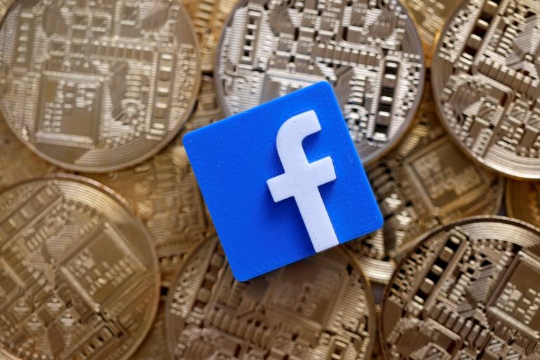 A 3-D printed Facebook logo is seen on representations of the Bitcoin virtual currency in this illustration picture, June 18, 2019. REUTERS/Dado Ruvic/Illustration
