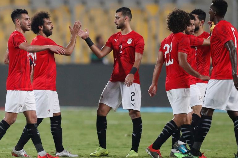 Soccer Football - International Friendly - Egypt v Guinea - Borg El Arab, Alexandria, Egypt - June 16, 2019 Egypt's Mohamed Salah and Baher El Mohamady celebrate after the match REUTERS/Amr Abdallah Dalsh