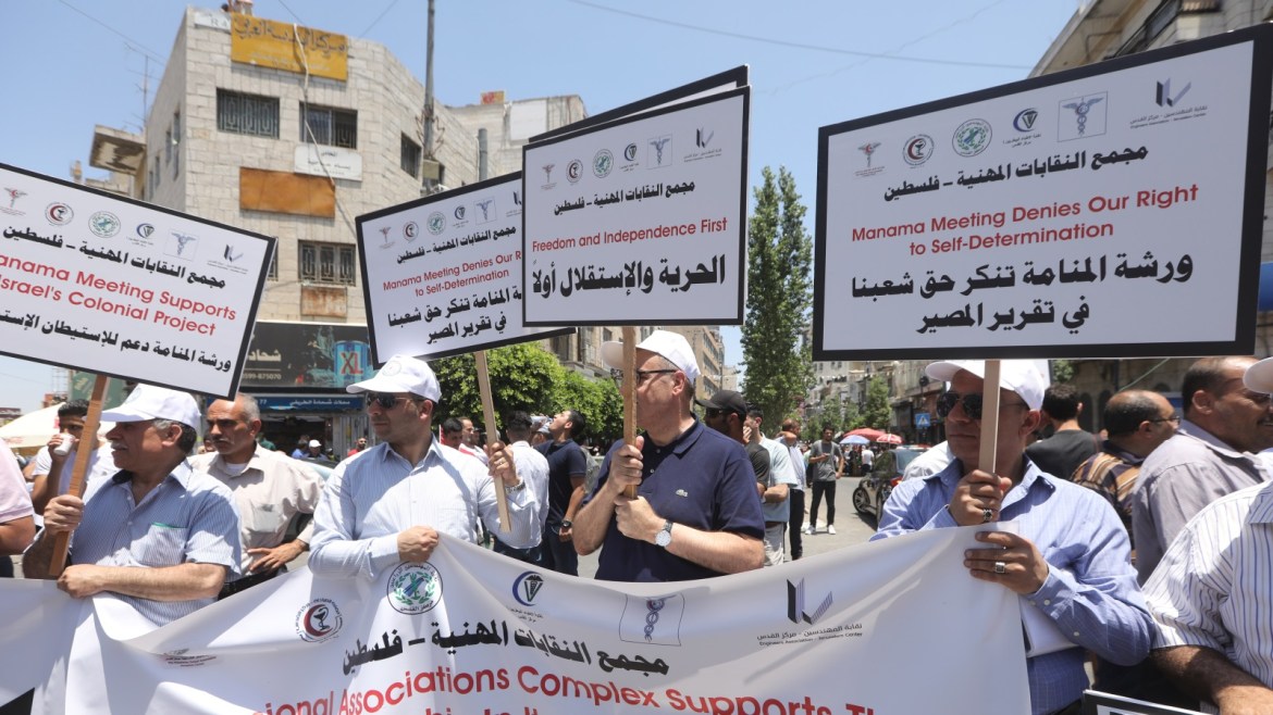 epa07670401 Palestinians protest against the expected US peace place in ramallah, West Bank , 24 June 2019. According to media reports, the US will hold an economic conference in Bahrain on 25 and 26 June, trying to promote investments in the Palestinians territories as the first part of the Middle East peace plan named also 'Deal of the Century'. Palestinian officials are boycotting the deal and have refused to engage with its Middle East peace plan. EPA