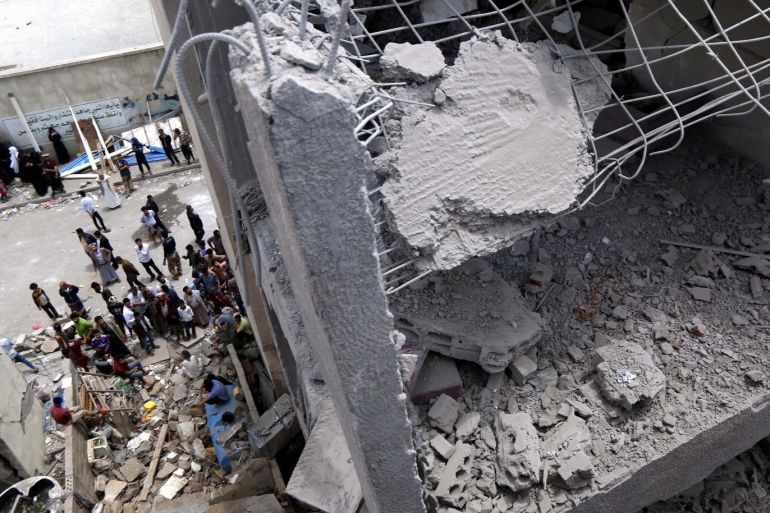 Saudi-led coalition's airstrike in Sanaa- - SANAA, YEMEN - MAY 16: People inspect a damaged building after an airstrike carried out by a Saudi-led military coalition in Sanaa, Yemen on May 16, 2019. At least 4 died, 48 injured in the airstrike.