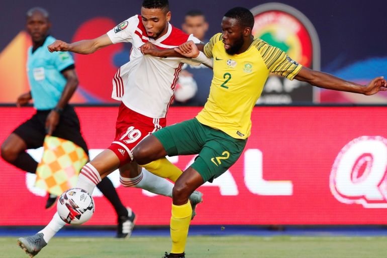 Soccer Football - Africa Cup of Nations 2019 - Group D - South Africa v Morocco - Al Salam Stadium, Cairo, Egypt - July 1, 2019 Morocco's Youssef En-Nesyri in action with South Africa's Buhle Mkhwanazi REUTERS/Amr Abdallah Dalsh