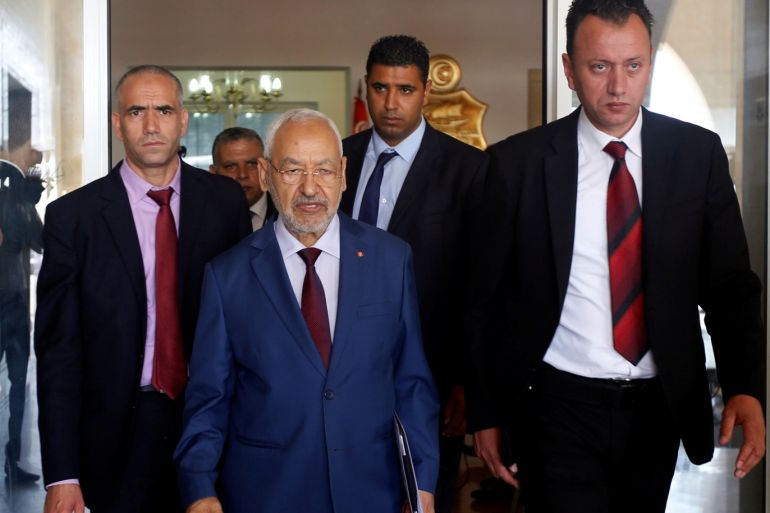 Rached Ghannouchi (C) head of the Ennahda party walks after his meeting with Tunisia's President Beji Caid Essebsi (not pictured) in Tunis Tunisia May 28 2018. REUTERS/Zoubeir Souissi