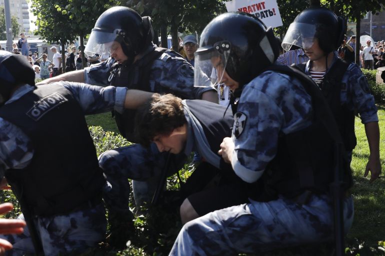 Unauthorized Rally in Moscow- - MOSCOW, RUSSIA - JULY 27: Police officers take a protester into custody during an unauthorized rally in support of rejected Moscow City Duma candidates held by Russian opposition in central Moscow, Russia on July 27, 2019.
