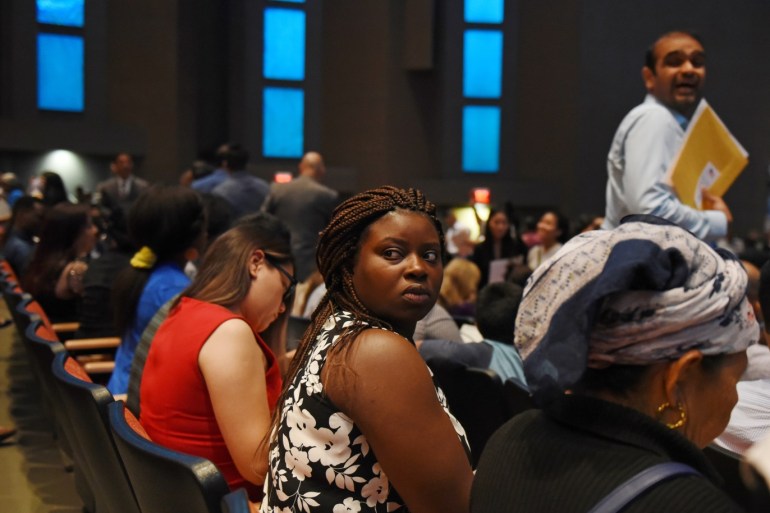 Esther Kamanzi, an immigrant from the Democratic Republic of Congo, looks at her family during her naturalization ceremony in San Antonio, Texas, U.S. June 13, 2019. REUTERS/Callaghan O'Hare