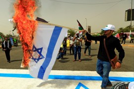 An Iraqi Shi'ite Muslim man Burns an Israeli flag during a parade marking the annual al-Quds Day, (Jerusalem Day) on the last Friday of the Muslim holy month of Ramadan in Baghdad, Iraq June 8, 2018. REUTERS/Thaier al-Sudani