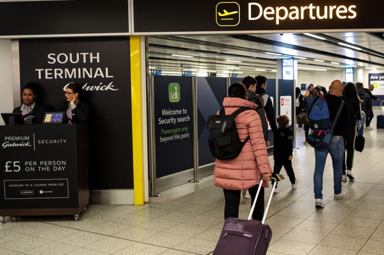 LONDON, ENGLAND - DECEMBER 21: Passengers make their way to the departure gate at London Gatwick Airport after flights resumed today on December 21, 2018 in London, England. Authorities at Gatwick have reopened the runway after drones were spotted over the airport on the night of December 19. The shutdown sparked a succession of delays and diversions in the run up to the Christmas getaway, in what authorities have called a