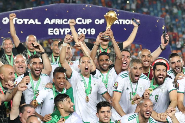 Soccer Football - Africa Cup of Nations 2019 - Final - Senegal v Algeria - Cairo International Stadium, Cairo, Egypt - July 19, 2019 Algeria's Riyad Mahrez lifts the trophy as they celebrate winning the Africa Cup of Nations REUTERS/Suhaib Salem
