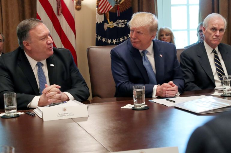 U.S. President Donald Trump shares a moment with U.S. Secretary of State Mike Pompeo during a cabinet meeting at the White House in Washington, U.S., July 16, 2019. REUTERS/Leah Millis