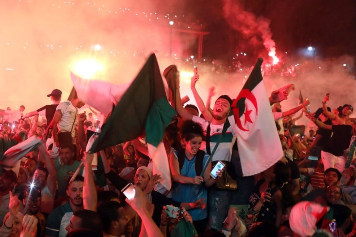 epa07728320 Algeria supporters celebrate after Algeria won the 2019 Africa Cup of Nations (AFCON) final soccer match between Algeria and Senegal, in Algiers, Algeria, 19 July 2019. EPA-EFE/MOHAMED MESSARA