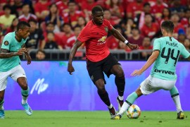 SINGAPORE - JULY 20: Paul Pogba of Manchester United and Ivan Perisic of FC Internazionale compete for the ball during the 2019 International Champions Cup match between Manchester United and FC Internazionale at the Singapore National Stadium on July 20, 2019 in Singapore. (Photo by Thananuwat Srirasant/Getty Images)