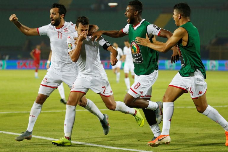 Soccer Football - Africa Cup of Nations 2019 - Quarter Final - Madagascar v Tunisia - Al Salam Stadium, Cairo, Egypt - July 11, 2019 Tunisia's Youssef Msakni celebrates scoring their second goal with team mates REUTERS/Amr Abdallah Dalsh