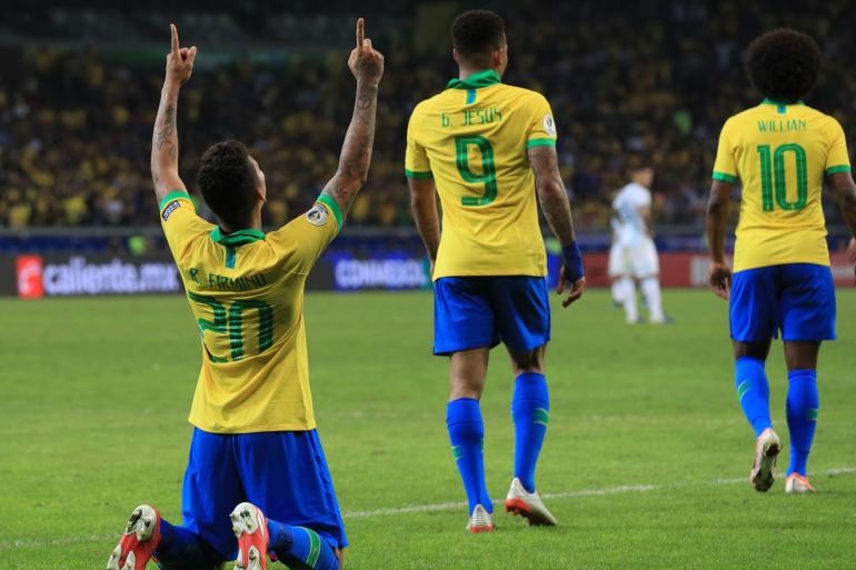 BELO HORIZONTE, BRAZIL - JULY 02: Roberto Firmino of Brazil celebrates after scoring the second goal of his team during the Copa America Brazil 2019 Semi Final match between Brazil and Argentina at Mineirao Stadium on July 02, 2019 in Belo Horizonte, Brazil. (Photo by Buda Mendes/Getty Images)