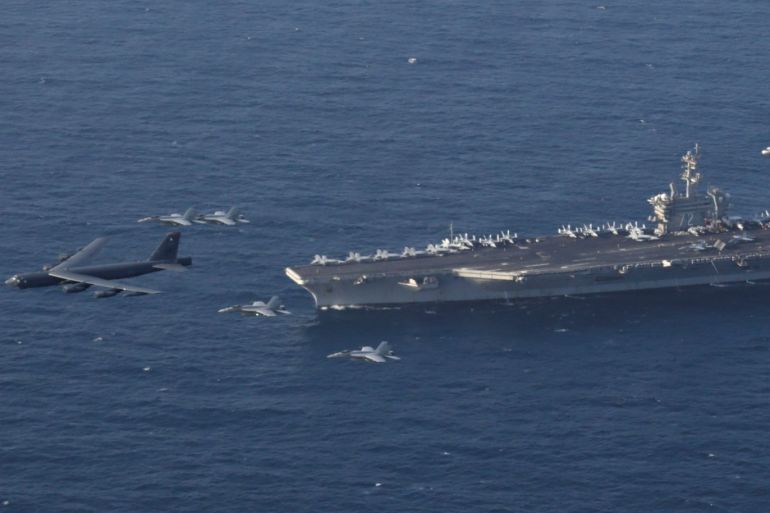 United States aircraft carrier Abraham Lincoln (CVN 72) and a U.S. Air Force B-52H Stratofortress, deployed to the region, conduct joint exercises in Arabian Sea, June 1, 2019. Picture taken June 1, 2019. Brian M. Wilbur/U.S. Navy/Handout via REUTERS ATTENTION EDITORS- THIS IMAGE HAS BEEN SUPPLIED BY A THIRD PARTY.