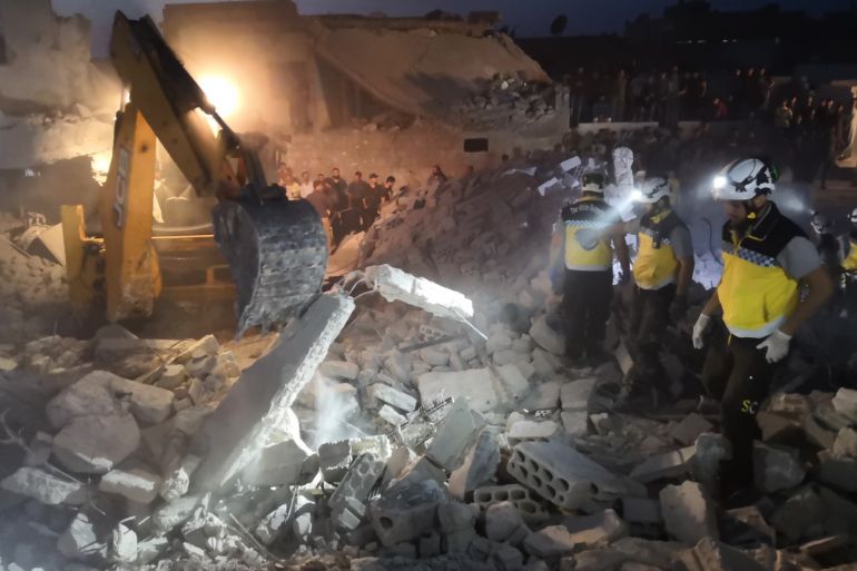 Airstrikes continue to hit Idlib- - IDLIB, SYRIA - JUNE 22: White Helmets and locals conduct search and rescue works at a debris of a building after Assad Regime's warplanes carried out airstrikes over the de-escalation zone of Saraqib district in Idlib, Syria on June 22, 2019. Air attacks reportedly killed 5 people and many injuries.