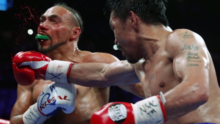LAS VEGAS, NEVADA - JULY 20: Keith Thurman (L) takes a punch from Manny Pacquiao during their WBA welterweight title fight at the MGM Grand Garden Arena on July 20, 2019 in Las Vegas, Nevada. Pacquiao won the fight by split decision. Steve Marcus/Getty Images/AFP== FOR NEWSPAPERS, INTERNET, TELCOS & TELEVISION USE ONLY ==