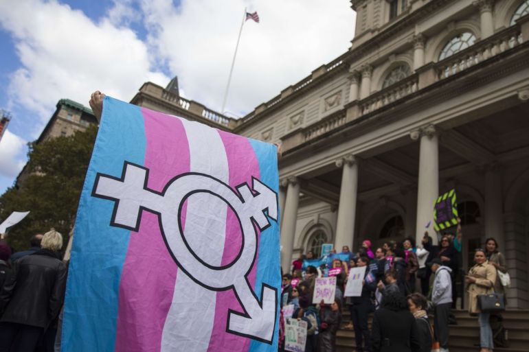 NEW YORK, NY - OCTOBER 24: L.G.B.T. activists and their supporters rally in support of transgender people on the steps of New York City Hall, October 24, 2018 in New York City. The group gathered to speak out against the Trump administration's stance toward transgender people. Last week, The New York Times reported on an unreleased administration memo that proposes a strict biological definition of gender based on a person's genitalia at birth. Drew Angerer/Getty Images/AFP== FOR NEWSPAPERS, INTERNET, TELCOS & TELEVISION USE ONLY ==