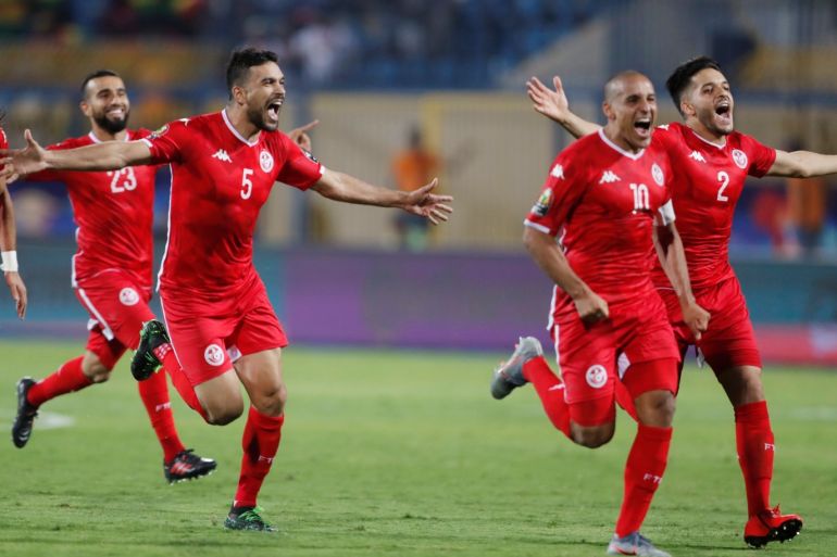 Soccer Football - Africa Cup of Nations 2019 - Round of 16 - Ghana v Tunisia - Ismailia Stadium, Ismailia, Egypt - July 8, 2019 Tunisia players celebrate after winning the match REUTERS/Amr Abdallah Dalsh