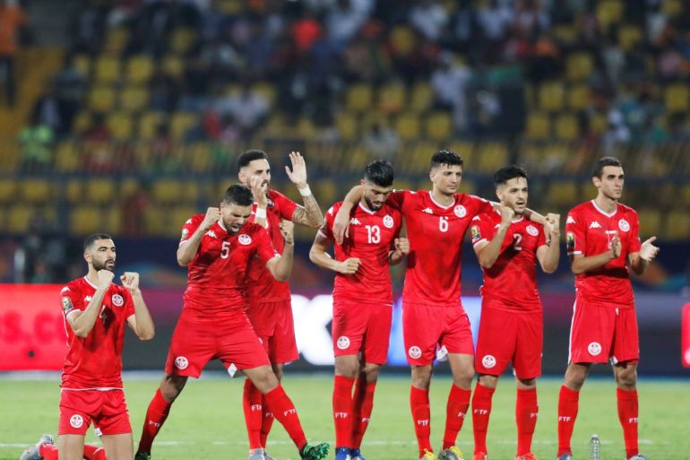 Soccer Football - Africa Cup of Nations 2019 - Round of 16 - Ghana v Tunisia - Ismailia Stadium, Ismailia, Egypt - July 8, 2019 Tunisia players celebrate during the penalty shootout REUTERS/Amr Abdallah Dalsh