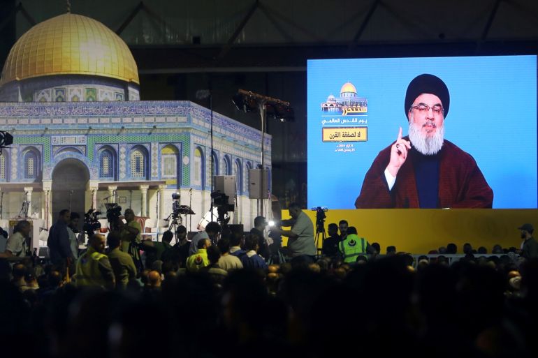 Lebanon's Hezbollah leader Sayyed Hassan Nasrallah addresses his supporters via a screen during a rally marking al-Quds Day, (Jerusalem Day) in Beirut, Lebanon May 31, 2019. REUTERS/Aziz Taher