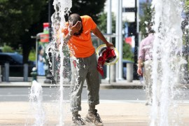 WASHINGTON, DC - JULY 19: A construction worker stops to cool off in the water fountains at Canal Park, on July 19, 2019 in Washington, DC. An excessive heat warning has been issued for the Washington area as temperatures approach triple digits. Mark Wilson/Getty Images/AFP== FOR NEWSPAPERS, INTERNET, TELCOS & TELEVISION USE ONLY ==
