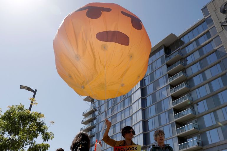Demonstrators holds a inflatable angry emoji during a protest outside the Facebook 2019 Annual Shareholder Meeting in Menlo Park, California, U.S., May 30, 2019. REUTERS/Stephen Lam