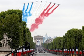 Alpha jets from the French Air Force Patrouille de France fly during the traditional Bastille Day military parade on the Champs-Elysees Avenue in Paris, France, July 14, 2019. REUTERS/Charles Platiau