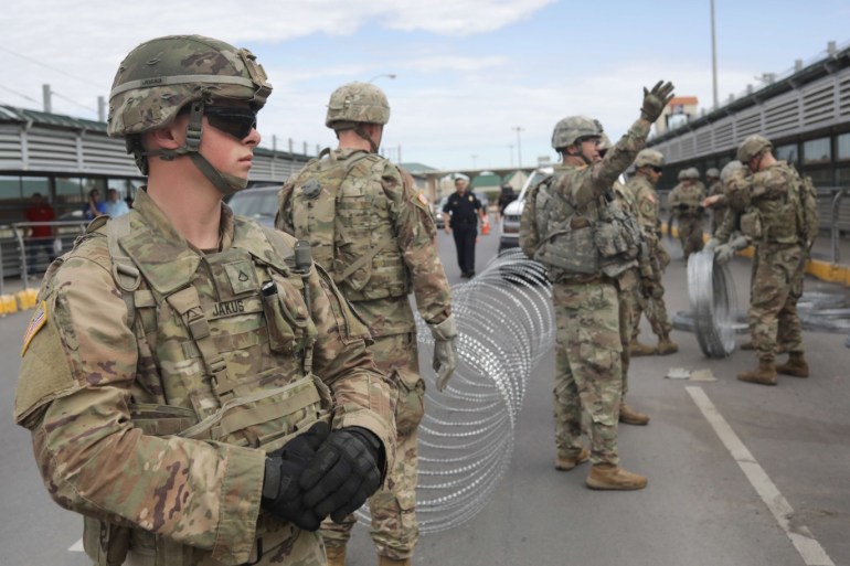 HIDALGO, TX - NOVEMBER 02: U.S. Army soldiers install concertina wire at the international bridge with Mexico on November 2, 2018 in Hidalgo, Texas. U.S. President Donald Trump ordered the troops to the border to bolster security at points where an immigrant caravan may attempt to cross in upcoming weeks. John Moore/Getty Images/AFP== FOR NEWSPAPERS, INTERNET, TELCOS & TELEVISION USE ONLY ==