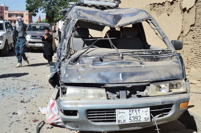 Afghanistan: Suicide car bombing kills 12 people- - GHAZNI, AFGHANISTAN - JULY 07: A damaged car is seen at the scene of a suicide bomb blast in Ghazni, Afghanistan on July 7, 2019. At least 12 people have been killed and 179 others were injured on suicide bomb blast.