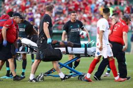 BOSTON, MASSACHUSETTS - JULY 21: Yasser Larouci #65 of Liverpool is taken off the field on a stretcher after being injured during the second half of a pre-season friendly against Sevilla at Fenway Park on July 21, 2019 in Boston, Massachusetts. Tim Bradbury/Getty Images/AFP== FOR NEWSPAPERS, INTERNET, TELCOS & TELEVISION USE ONLY ==