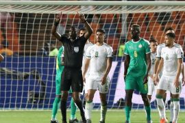 Soccer Football - Africa Cup of Nations 2019 - Final - Senegal v Algeria - Cairo International Stadium, Cairo, Egypt - July 19, 2019 Referee Neant Alioum refers to VAR after awarding a penalty to Senegal REUTERS/Suhaib Salem