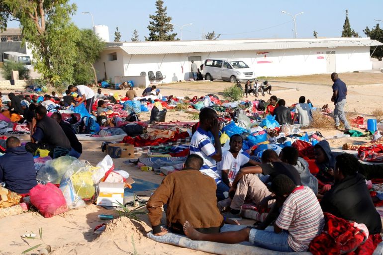 Migrants are seen with their belongings at the yard of a detention centre for mainly African migrants, hit by an airstrike, in the Tajoura suburb of Tripoli, Libya July 3, 2019. REUTERS/Ismail Zitouny