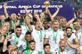 Soccer Football - Africa Cup of Nations 2019 - Final - Senegal v Algeria - Cairo International Stadium, Cairo, Egypt - July 19, 2019 Algeria's Riyad Mahrez lifts the trophy as they celebrate winning the Africa Cup of Nations REUTERS/Suhaib Salem
