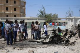 Bomb-laden vehicle attack in Somalia- - MOGADISHU, SOMALIA - MARCH 23: Explosion site is seen after a terror attack carried out by Al-Qaeda-affiliated terrorist group al-Shabaab with a bomb-laden vehicle near two ministry buildings in the Somalia capital Mogadishu which killed at least 5 people on March 23, 2019.