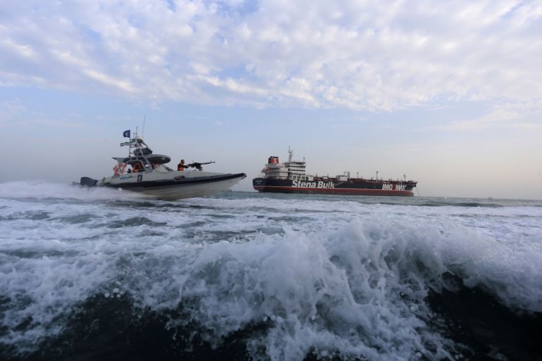 A boat of the Iranian Revolutionary Guard sails close to Stena Impero, a British-flagged vessel owned by Stena Bulk, near Bandar Abbas port, Iran July 21, 2019. Picture taken July 21, 2019. Fars News Agency/ WANA Handout via REUTERS ATTENTION EDITORS - THIS IMAGE WAS PROVIDED BY A THIRD PARTY.