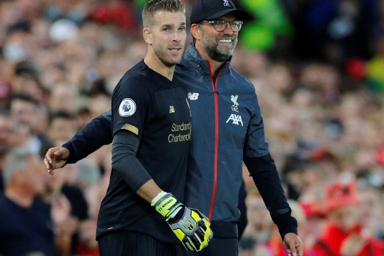 Soccer Football - Premier League - Liverpool v Norwich City - Anfield, Liverpool, Britain - August 9, 2019 Liverpool's Adrian with manager Juergen Klopp before being substituted on REUTERS/Phil Noble EDITORIAL USE ONLY. No use with unauthorized audio, video, data, fixture lists, club/league logos or
