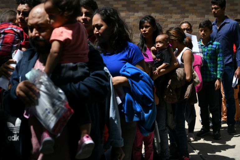 Migrant families seeking asylum are released from federal detention at a bus depot in McAllen, Texas, U.S., July 31, 2019. REUTERS/Loren Elliott