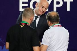 Soccer Football - Africa Cup of Nations 2019 - Final - Senegal v Algeria - Cairo International Stadium, Cairo, Egypt - July 19, 2019 FIFA President Gianni Infantino shakes hands with Algeria coach Djamel Belmadi after the match REUTERS/Amr Abdallah Dalsh