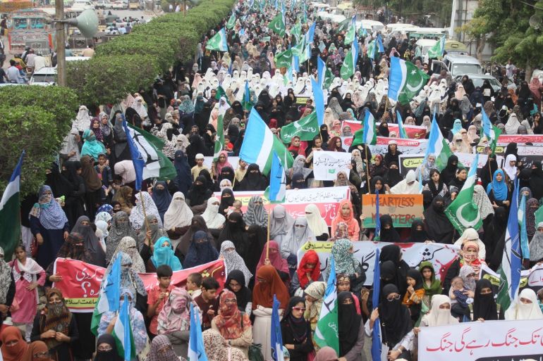 Supporters of Islamic party Jammat-e-Islami (JI) protest against India- - KARACHI, PAKISTAN - AUGUST 08: Pakistani women, supporters of Islamic party Jammat-e-Islami (JI), stage a protest against the Indian government's decision to repeal Article 370 of the Constitution that grants special status to Jammu and Kashmir in Karachi, Pakistan on August 08, 2019.