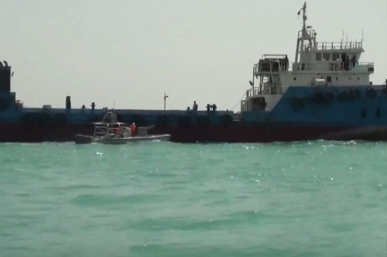 epa07756693 A handout video grab made available from Iranian state television's English-language service Press TV shows Iran's Islamic Revolution Guards Corps (IRGC) boat sailing next to seized foreign oil tanker at an unidentified location on the Persian Gulf, 31 July 2019 (issued 04 August 2019). According to media reports, the Iranian Revolutionary Guards (IRGC) seized another 'foreign' oil tanker in the Persian Gulf, claiming it was smuggling fuel to a Gulf Arab states. The seizure took place on 31 July. The owner of the ship has not named yet. EPA-EFE/PRESS TV HANDOUT HANDOUT EDITORIAL USE ONLY/NO SALES
