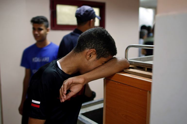 A relative of a Palestinian gunman who was killed by Israeli forces as he tried with others to cross the Gaza border, reacts at a hospital in the northern Gaza Strip August 18, 2019. REUTERS/Mohammed Salem