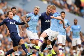 MANCHESTER, ENGLAND - AUGUST 17: Christian Eriksen of Tottenham Hotspur challenges for the ball with Nicolas Otamendi and Kevin De Bruyne of Manchester City during the Premier League match between Manchester City and Tottenham Hotspur at Etihad Stadium on August 17, 2019 in Manchester, United Kingdom. (Photo by Shaun Botterill/Getty Images)