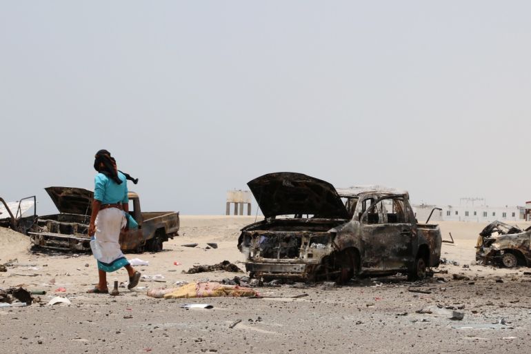 ATTENTION EDITORS - SENSITIVE MATERIAL. THIS IMAGE MAY OFFEND OR DISTURB A man walks past the wreckage of government forces vehicles destroyed by UAE air strikes near Aden, Yemen, August 30, 2019. REUTERS/Fawaz Salman