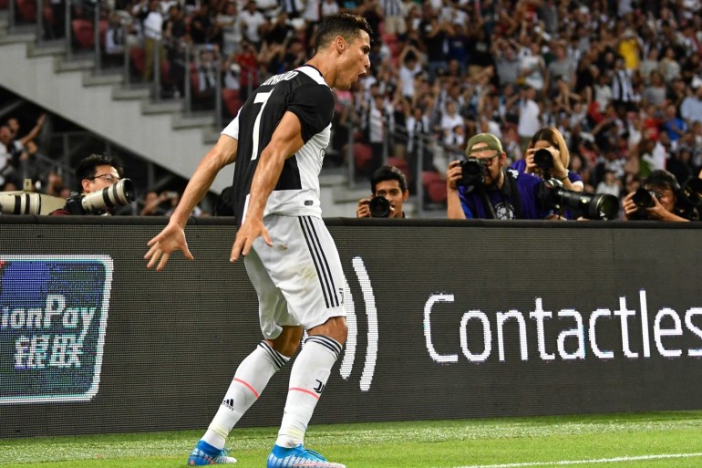 SINGAPORE, SINGAPORE - JULY 21: Cristiano Ronaldo of Juventus celebrates scoring his side's second goal during the International Champions Cup match between Juventus and Tottenham Hotspur at the Singapore National Stadium on July 21, 2019 in Singapore. (Photo by Thananuwat Srirasant/Getty Images)