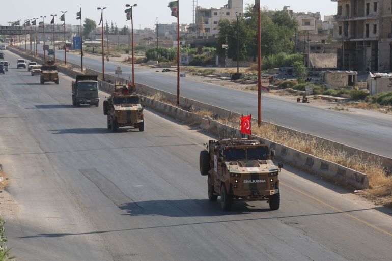 Turkish military reinforce observation points in Idlib- - IDLIB, SYRIA - AUGUST 22: Turkish military armoured vehicles are deployed to the observations point in Idlib, de-escalation zone, Syria on August 22, 2019.